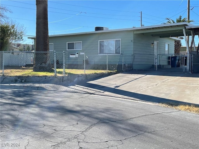 back of property featuring a carport