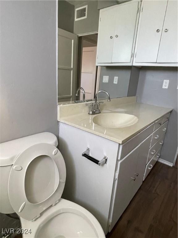 14 California Way, Henderson, NV 89015 - bathroom with hardwood / wood-style floors, vanity, and toilet