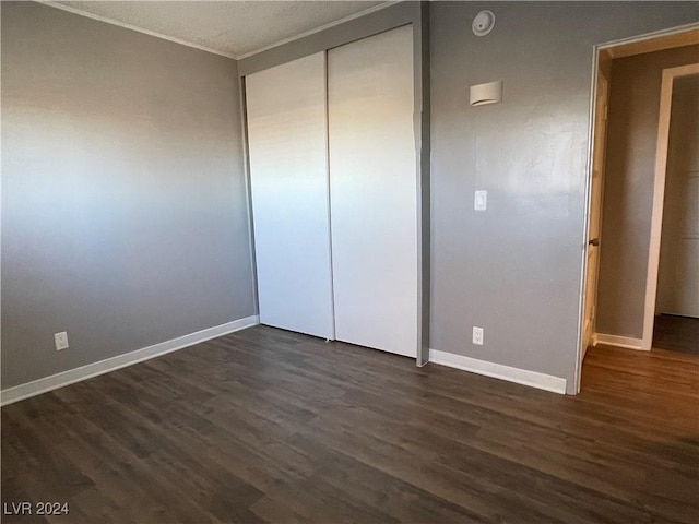 14 California Way, Henderson, NV 89015 - unfurnished bedroom featuring a closet, dark wood-type flooring, and a textured ceiling
