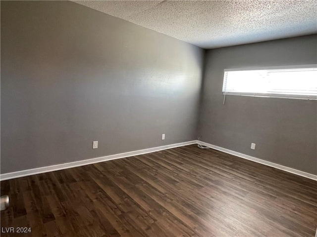 14 California Way, Henderson, NV 89015 - unfurnished room featuring a textured ceiling and dark wood-type flooring