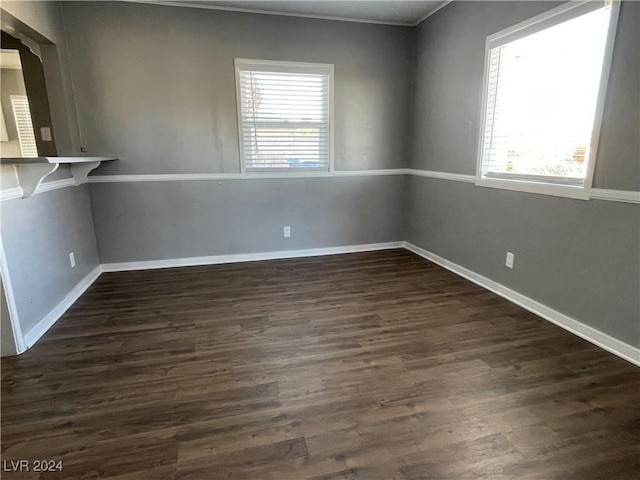 14 California Way, Henderson, NV 89015 - empty room featuring dark hardwood / wood-style floors, crown molding, and a healthy amount of sunlight