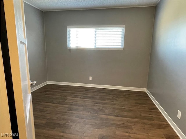 14 California Way, Henderson, NV 89015 - spare room featuring a textured ceiling and dark wood-type flooring