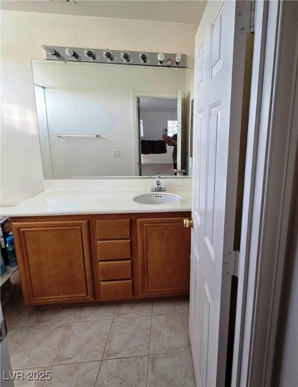 bathroom with vanity and tile patterned floors