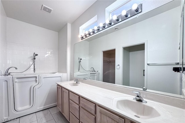 bathroom with vanity and a tub to relax in