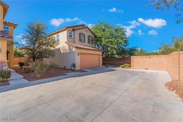 view of side of property featuring a garage