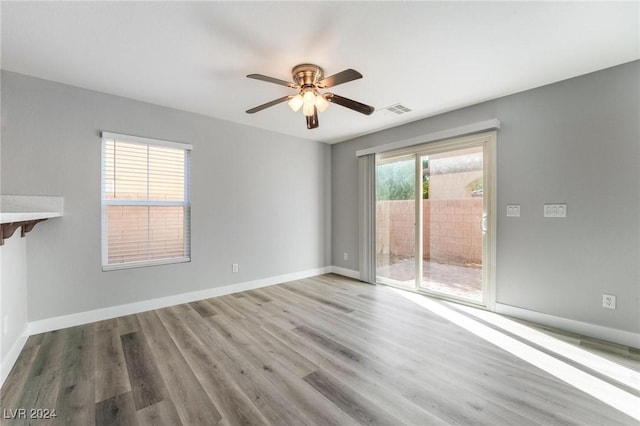 unfurnished room featuring ceiling fan and hardwood / wood-style flooring