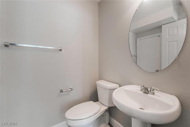 bathroom with sink and toilet