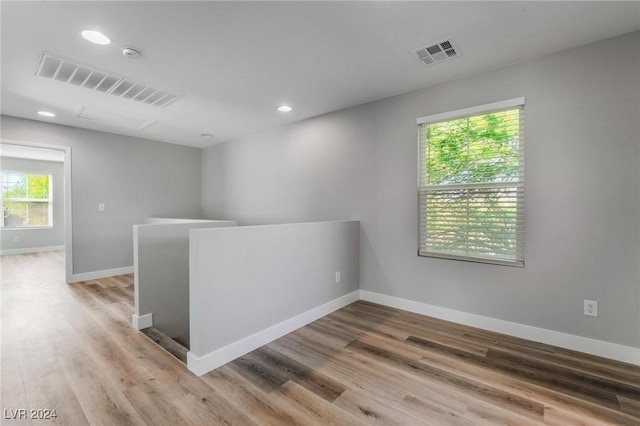 empty room with wood-type flooring