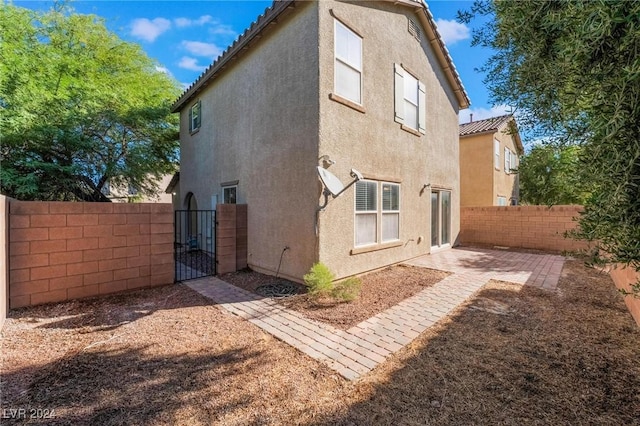 rear view of property with a patio area