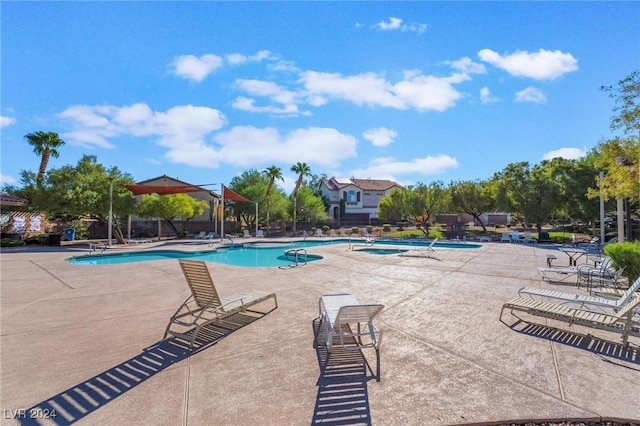 view of swimming pool featuring a patio area