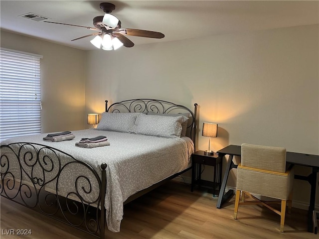 bedroom featuring ceiling fan and light wood-type flooring