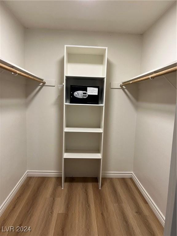 spacious closet featuring hardwood / wood-style floors