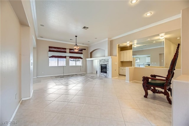 living room with a fireplace, light tile patterned floors, and ornamental molding