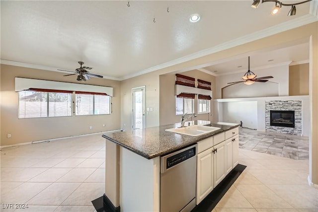 kitchen with white cabinetry, dishwasher, sink, crown molding, and an island with sink