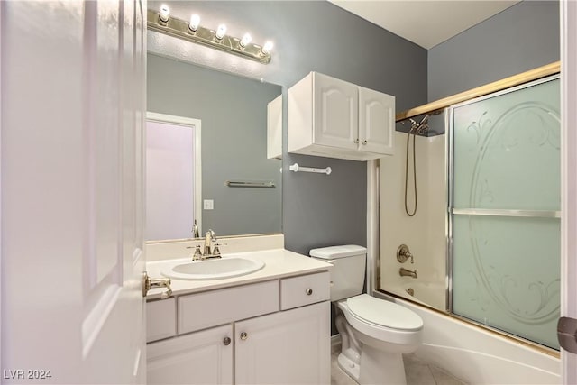 full bathroom with tile patterned floors, vanity, toilet, and enclosed tub / shower combo