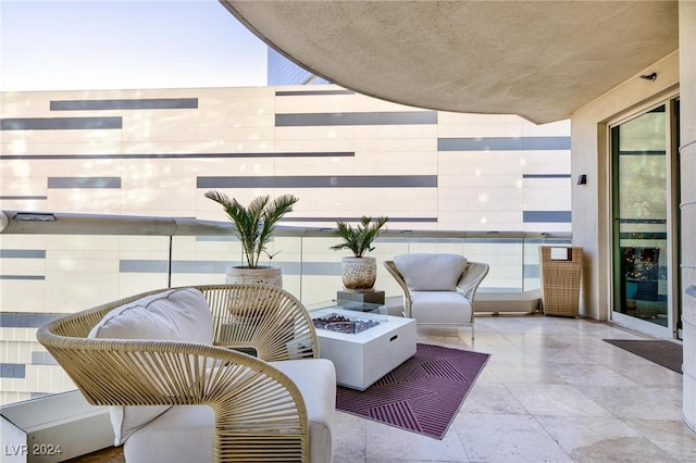 balcony with an outdoor fire pit