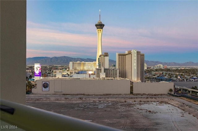 property's view of city featuring a mountain view