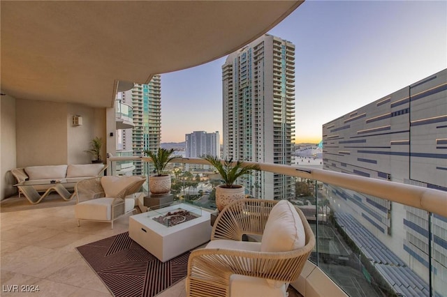 balcony at dusk with an outdoor fire pit