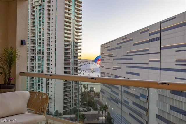 view of balcony at dusk