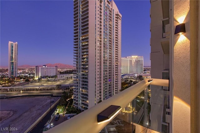 view of balcony at dusk