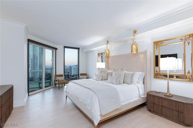 bedroom featuring light hardwood / wood-style flooring and ornamental molding