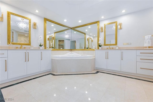 bathroom featuring vanity, tile patterned floors, and a tub