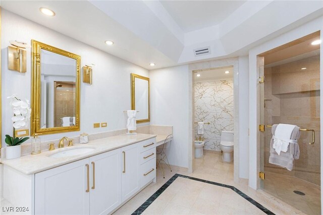 bathroom with vanity, a bidet, tile patterned flooring, toilet, and a shower with shower door