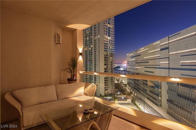 balcony at twilight featuring an outdoor living space