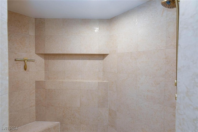 bathroom featuring tiled shower