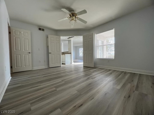 interior space featuring ceiling fan and wood-type flooring