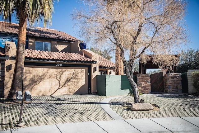 view of side of property with a garage