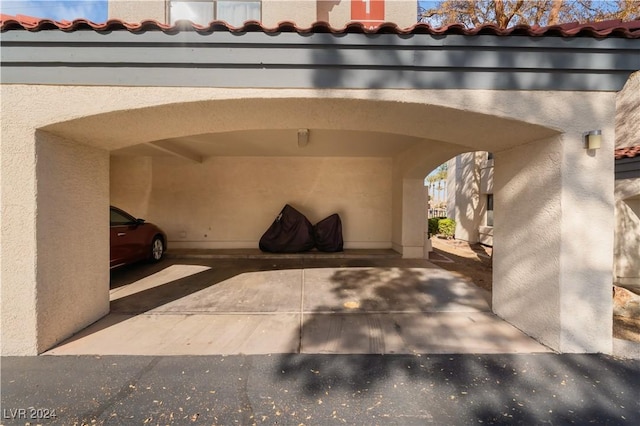 view of parking / parking lot with a carport