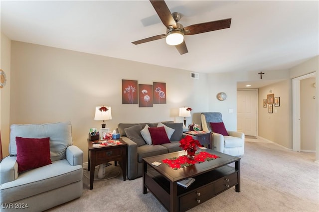 carpeted living room featuring ceiling fan