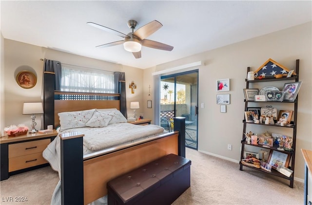 carpeted bedroom featuring access to outside, multiple windows, and ceiling fan