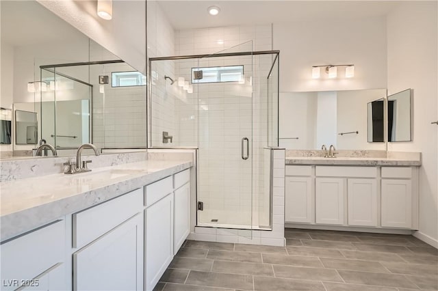 104 Barkset Way, Henderson, NV 89011 - bathroom with two vanities, a stall shower, and recessed lighting