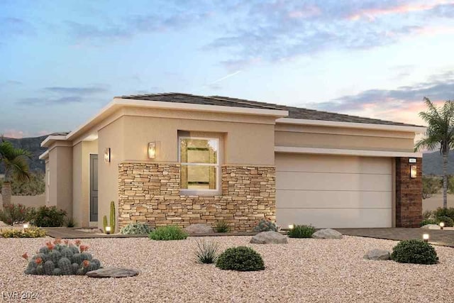 prairie-style house featuring a garage