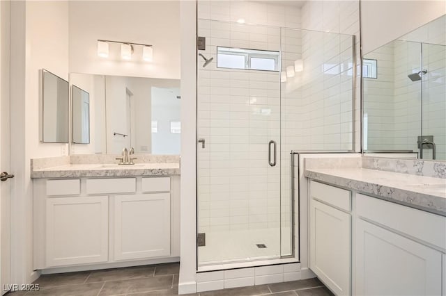 106 Barkset Way, Henderson, NV 89011 - bathroom featuring a stall shower, two vanities, and tile patterned floors