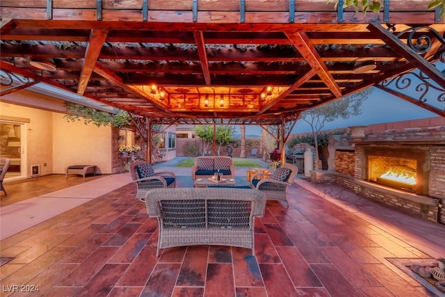 view of patio / terrace with an outdoor living space with a fireplace