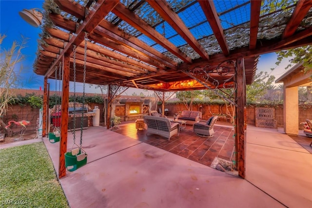 patio terrace at dusk with a pergola and an outdoor hangout area