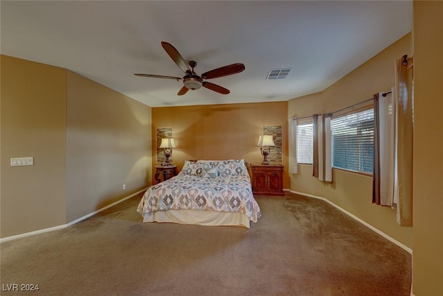 unfurnished bedroom with ceiling fan and carpet