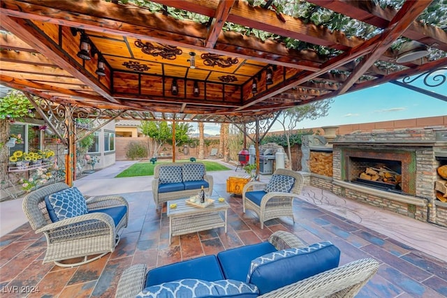 view of patio / terrace featuring a gazebo and an outdoor living space with a fireplace