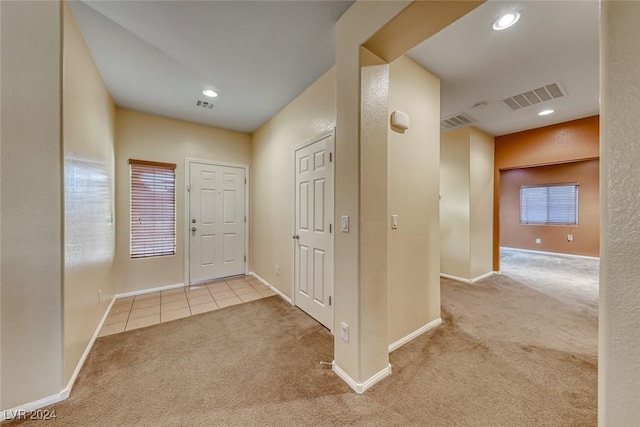 view of carpeted foyer