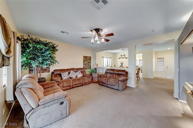 living room featuring carpet flooring and ceiling fan