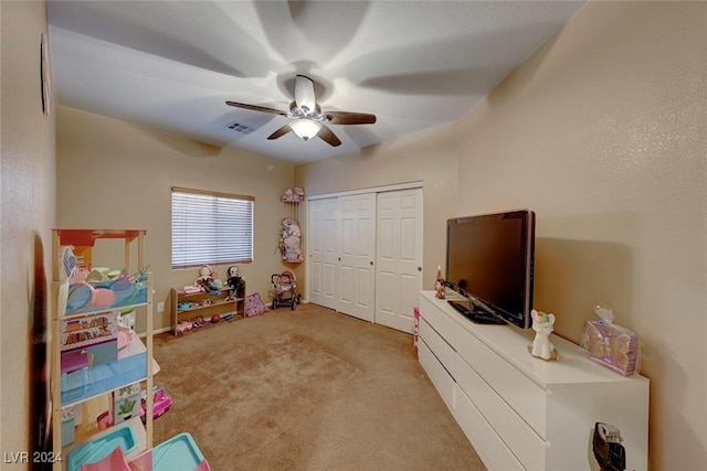 recreation room featuring ceiling fan and light colored carpet