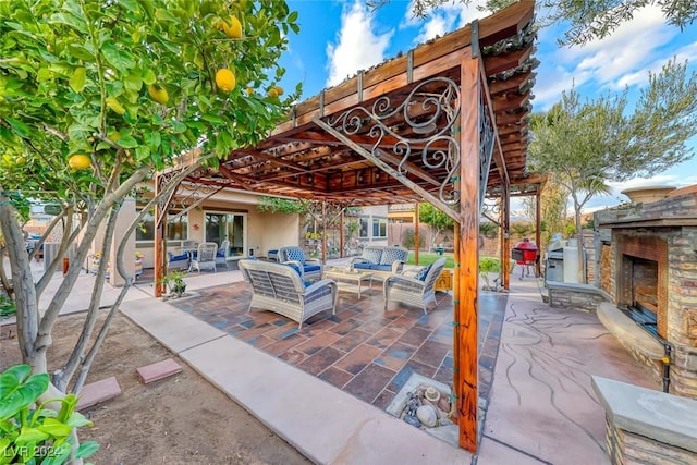 view of patio with an outdoor living space with a fireplace