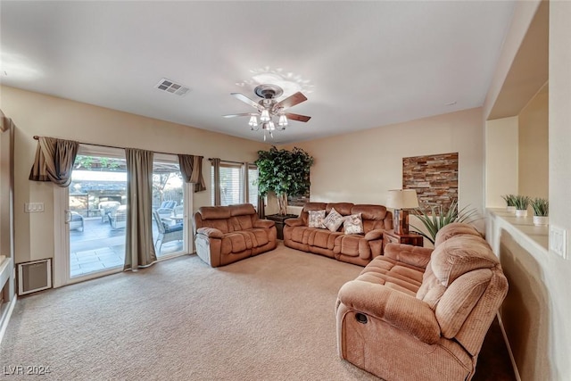 living room featuring ceiling fan and carpet floors