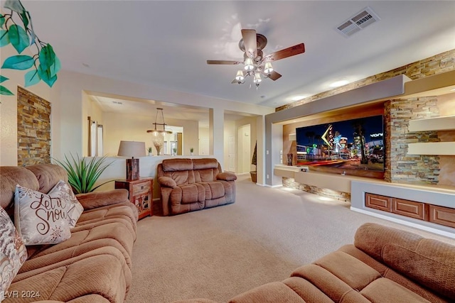 living room featuring carpet and ceiling fan