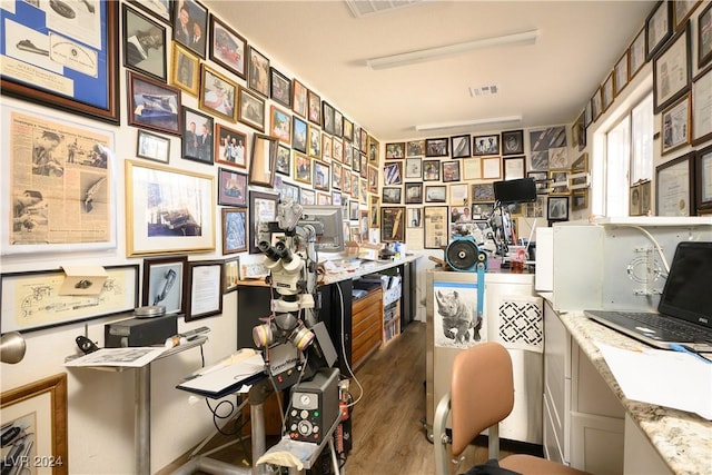 office with dark wood-type flooring