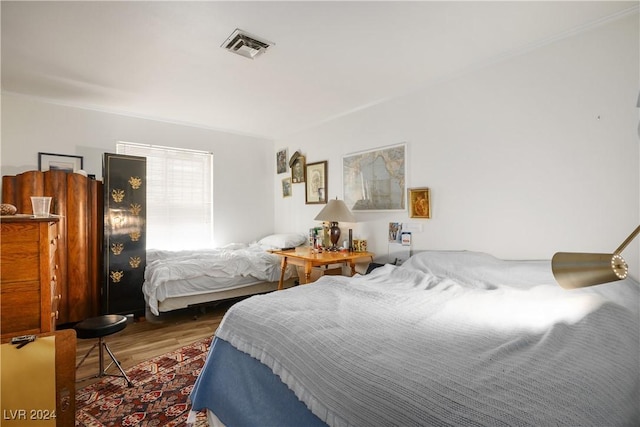 bedroom featuring dark hardwood / wood-style flooring