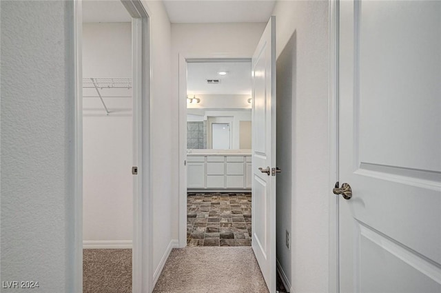 corridor with carpet floors